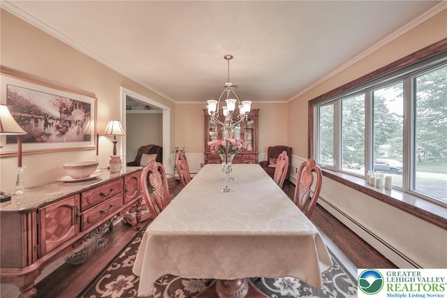 1812 Treeline Dr, Forks Twp, PA 18040 - dining space featuring dark wood-type flooring, a baseboard heating unit, a chandelier, healthy amount of natural light, and crown molding