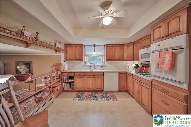 1812 Treeline Dr, Forks Twp, PA 18040 - kitchen featuring white appliances, ceiling fan, brown cabinets, light countertops, and a raised ceiling