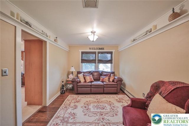 1812 Treeline Dr, Forks Twp, PA 18040 - living area featuring baseboard heating and dark wood finished floors