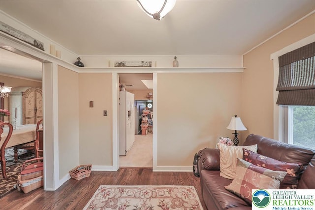 1812 Treeline Dr, Forks Twp, PA 18040 - living area featuring wood finished floors, crown molding, and a chandelier