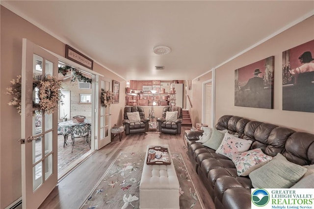 1812 Treeline Dr, Forks Twp, PA 18040 - living area with a baseboard heating unit, wood finished floors, french doors, and stairs