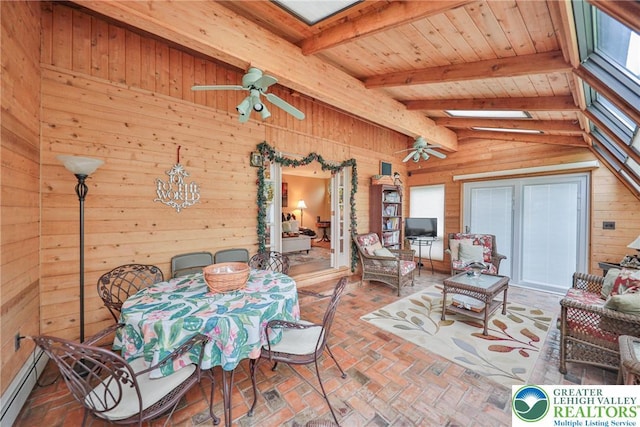 1812 Treeline Dr, Forks Twp, PA 18040 - dining area with wood walls, ceiling fan, brick flooring, and a skylight