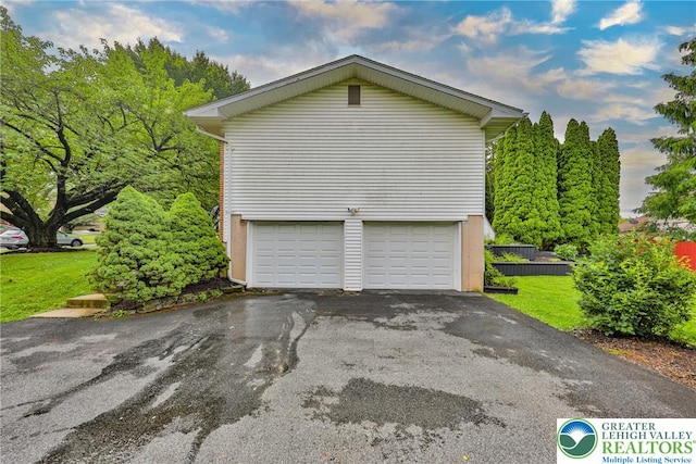 1812 Treeline Dr, Forks Twp, PA 18040 - view of home's exterior featuring driveway, a garage, and a lawn