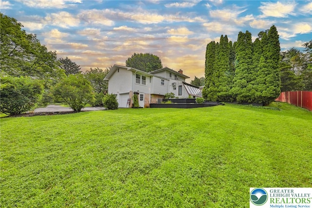 1812 Treeline Dr, Forks Twp, PA 18040 - yard at dusk featuring an attached garage