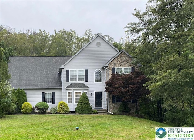 120 Palomino Cir, Washington Twp, PA 18013 - traditional-style home with a front yard, stone siding, and a shingled roof