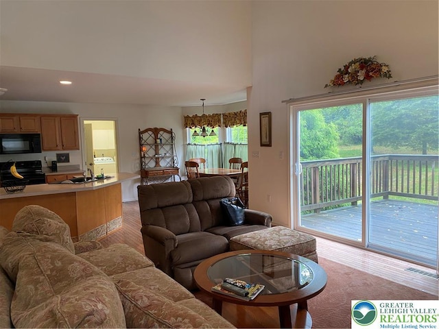 120 Palomino Cir, Washington Twp, PA 18013 - living room with light wood-style flooring, a towering ceiling, recessed lighting, and washer / dryer