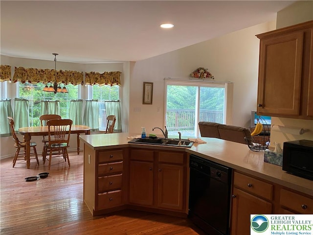 120 Palomino Cir, Washington Twp, PA 18013 - kitchen with black appliances, light countertops, light wood-style floors, recessed lighting, and brown cabinets