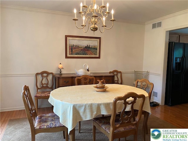 120 Palomino Cir, Washington Twp, PA 18013 - dining room featuring hardwood / wood-style floors, a chandelier, and ornamental molding