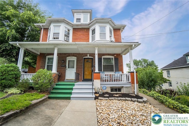 537 Seitz St, Easton, PA 18042 - view of front of home featuring brick siding and a porch