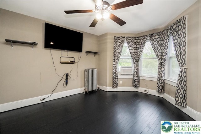 537 Seitz St, Easton, PA 18042 - unfurnished living room with radiator heating unit, cooling unit, a ceiling fan, and dark wood finished floors