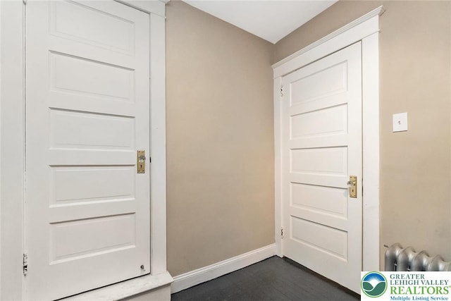 537 Seitz St, Easton, PA 18042 - doorway to outside featuring baseboards and dark wood-type flooring