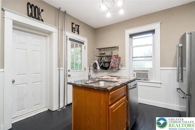 537 Seitz St, Easton, PA 18042 - kitchen featuring stainless steel appliances, brown cabinets, wainscoting, cooling unit, and dark wood-style flooring