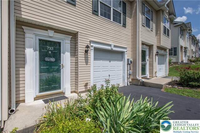 733 Trout Creek Ln, Allentown City, PA 18103 - property entrance featuring an attached garage and driveway
