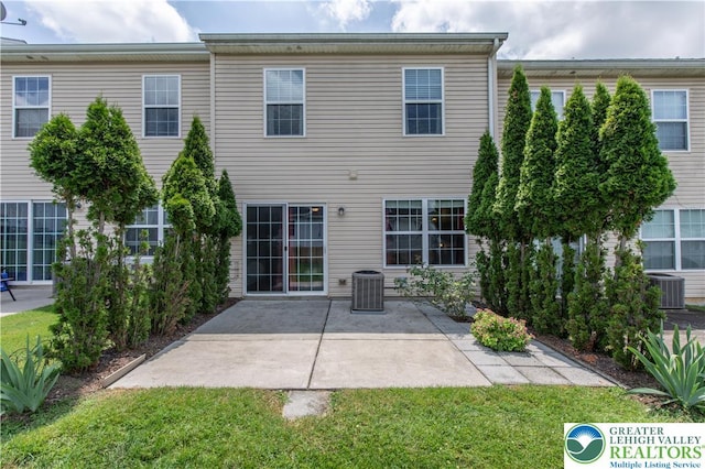 733 Trout Creek Ln, Allentown City, PA 18103 - back of house featuring a patio area and a lawn