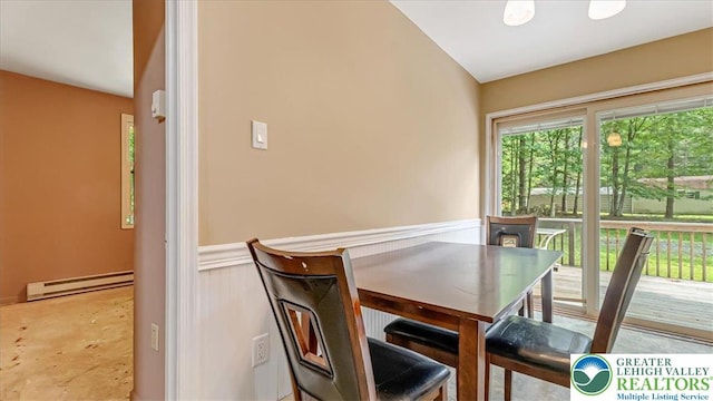 671 Dotters Corner Rd, Polk Twp, PA 18058 - dining area with a baseboard heating unit and a wainscoted wall