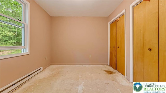 671 Dotters Corner Rd, Polk Twp, PA 18058 - unfurnished bedroom with baseboard heating and two closets