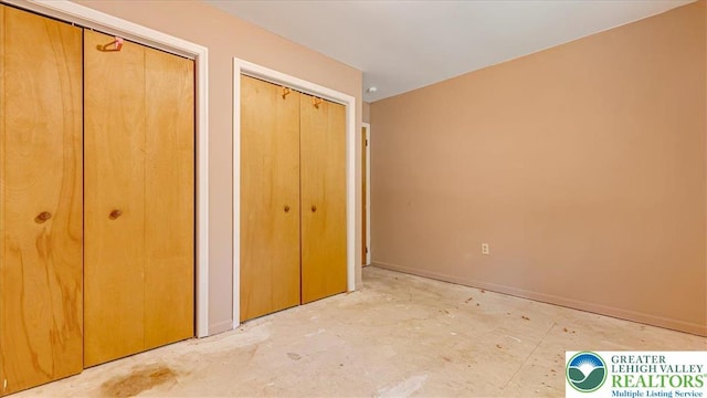 671 Dotters Corner Rd, Polk Twp, PA 18058 - unfurnished bedroom with two closets and baseboards
