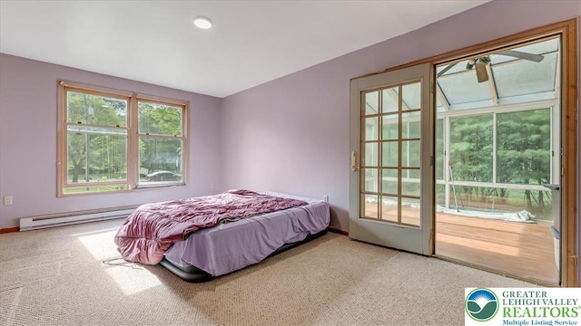 671 Dotters Corner Rd, Polk Twp, PA 18058 - carpeted bedroom featuring a baseboard heating unit and access to exterior