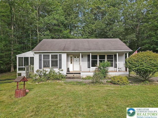 671 Dotters Corner Rd, Polk Twp, PA 18058 - view of front of house with a front yard, a porch, and a sunroom