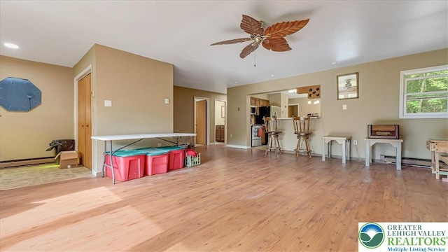 671 Dotters Corner Rd, Polk Twp, PA 18058 - sitting room featuring wood finished floors, a ceiling fan, and baseboard heating