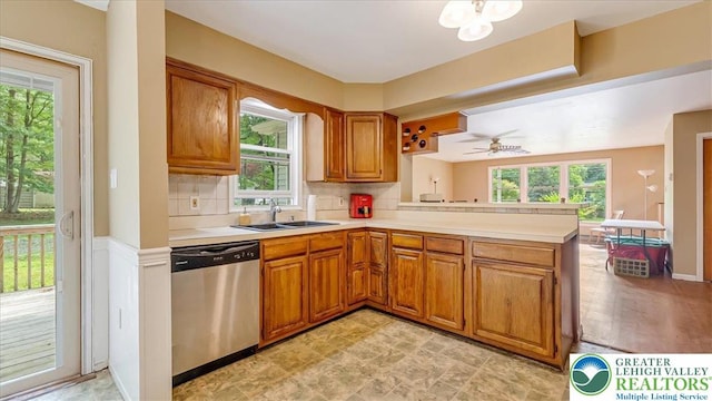 671 Dotters Corner Rd, Polk Twp, PA 18058 - kitchen featuring dishwasher, a peninsula, brown cabinets, and light countertops