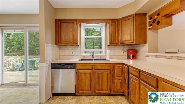 671 Dotters Corner Rd, Polk Twp, PA 18058 - kitchen with dishwasher, brown cabinetry, light countertops, and plenty of natural light