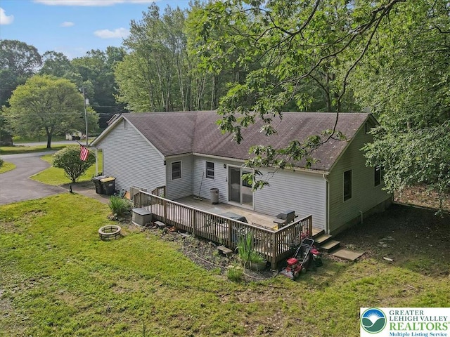 671 Dotters Corner Rd, Polk Twp, PA 18058 - back of property featuring a yard and a deck