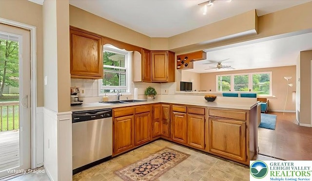 671 Dotters Corner Rd, Polk Twp, PA 18058 - kitchen featuring stainless steel dishwasher, a peninsula, brown cabinets, light countertops, and ceiling fan