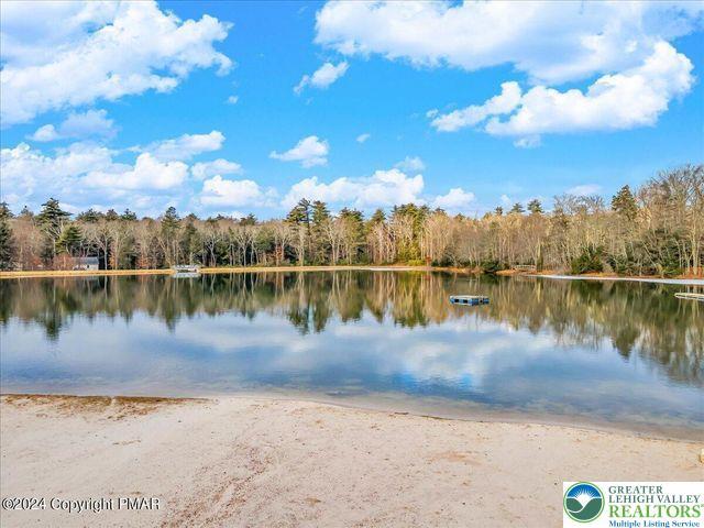 671 Dotters Corner Rd, Polk Twp, PA 18058 - water view featuring a forest