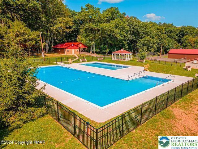 671 Dotters Corner Rd, Polk Twp, PA 18058 - community pool featuring a gazebo, an outdoor structure, and a patio