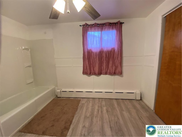 838 E Patterson St, Lansford Boro, PA 18232 - bathroom featuring baseboard heating, wood finished floors, ceiling fan, and bathing tub / shower combination