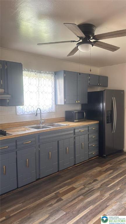 838 E Patterson St, Lansford Boro, PA 18232 - kitchen featuring gray cabinets, range hood, a ceiling fan, and tasteful backsplash