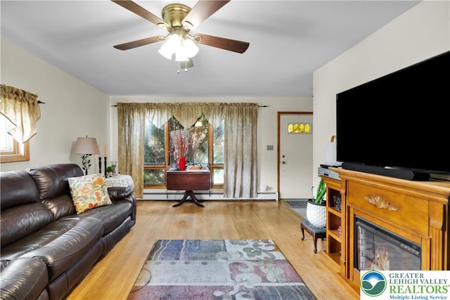 1919 W Cedar St Unit 1919, Allentown City, PA 18104 - living area with wood finished floors, ceiling fan, and a baseboard heating unit