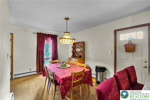 1919 W Cedar St Unit 1919, Allentown City, PA 18104 - dining room with baseboard heating, plenty of natural light, wood finished floors, and a baseboard radiator