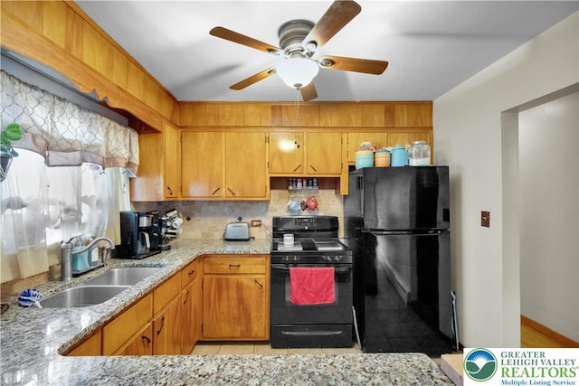 1919 W Cedar St Unit 1919, Allentown City, PA 18104 - kitchen with black appliances, tasteful backsplash, a ceiling fan, and light stone counters