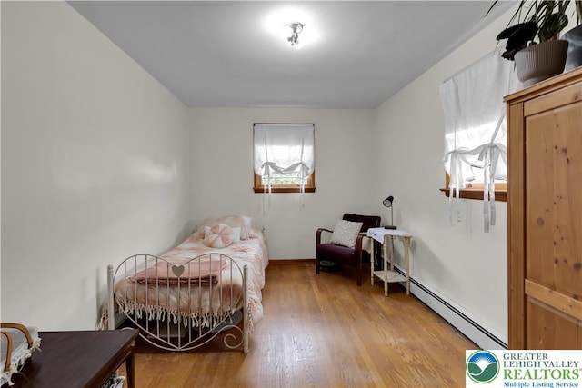1919 W Cedar St Unit 1919, Allentown City, PA 18104 - bedroom featuring a baseboard radiator and light wood finished floors