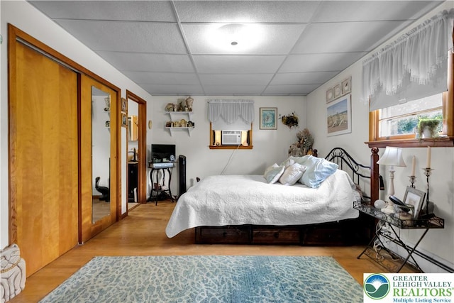 1919 W Cedar St Unit 1919, Allentown City, PA 18104 - bedroom with a paneled ceiling, cooling unit, and wood finished floors