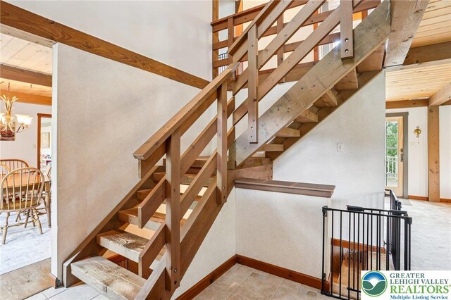 6365 Constitution Rd, Lowhill Twp, PA 18078 - stairs featuring a chandelier and beam ceiling
