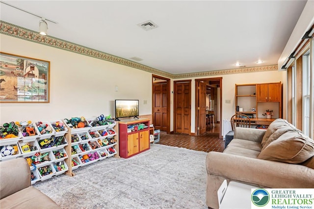 6365 Constitution Rd, Lowhill Twp, PA 18078 - living area featuring rail lighting and brick patterned floors