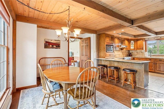6365 Constitution Rd, Lowhill Twp, PA 18078 - dining area featuring light wood finished floors, a wooden ceiling with exposed beams, a chandelier, and a baseboard heating unit