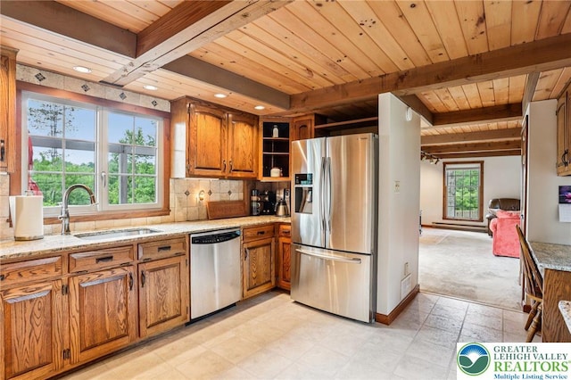6365 Constitution Rd, Lowhill Twp, PA 18078 - kitchen with stainless steel appliances, brown cabinets, a wood ceiling with exposed beams, light stone countertops, and decorative backsplash