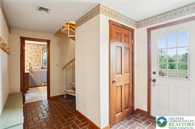 6365 Constitution Rd, Lowhill Twp, PA 18078 - entryway with brick flooring, stairs, and baseboard heating