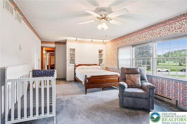 6365 Constitution Rd, Lowhill Twp, PA 18078 - bedroom with a baseboard radiator, carpet floors, wallpapered walls, a ceiling fan, and golf course view
