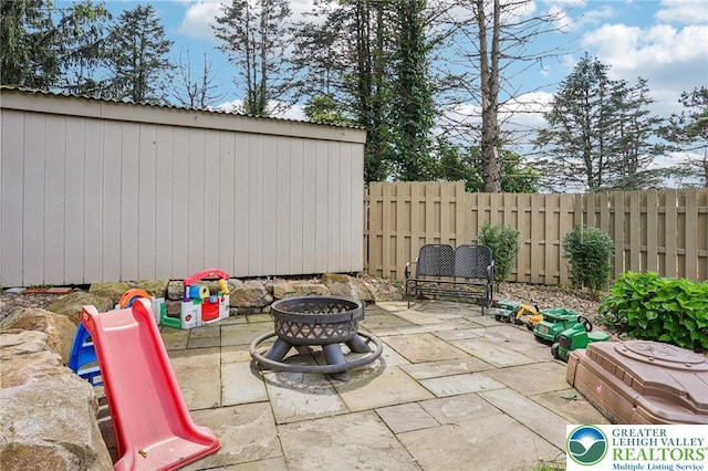 6365 Constitution Rd, Lowhill Twp, PA 18078 - fenced backyard with an outdoor fire pit and a patio area