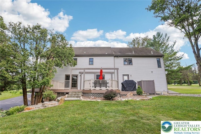 6365 Constitution Rd, Lowhill Twp, PA 18078 - rear view of property featuring a wooden deck and a lawn