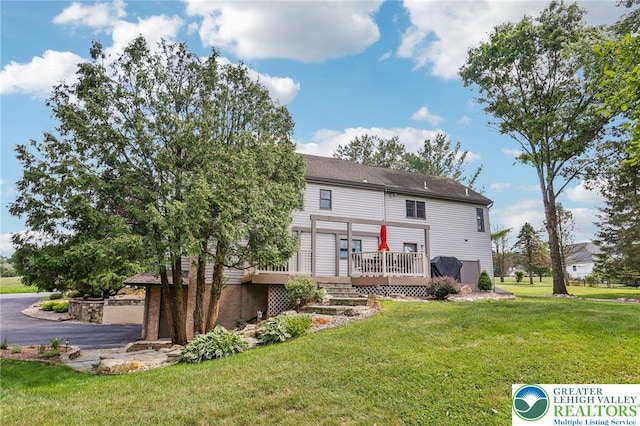 6365 Constitution Rd, Lowhill Twp, PA 18078 - rear view of house featuring a wooden deck, a yard, and stairs