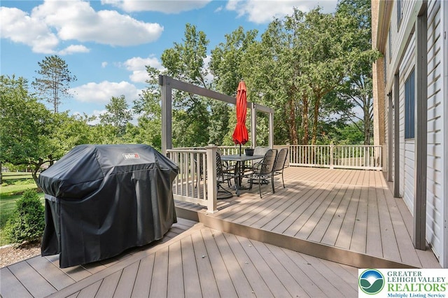 6365 Constitution Rd, Lowhill Twp, PA 18078 - deck with a grill, outdoor dining area, and view of scattered trees