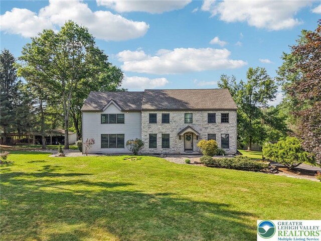 6365 Constitution Rd, Lowhill Twp, PA 18078 - colonial inspired home with stone siding and a front lawn