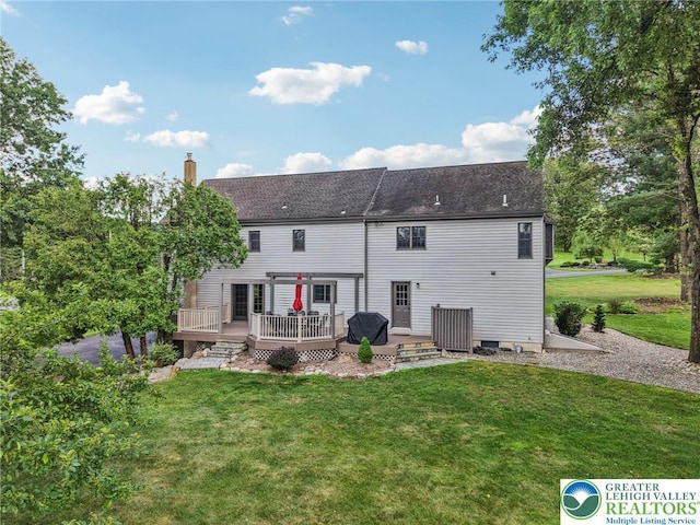 6365 Constitution Rd, Lowhill Twp, PA 18078 - back of house featuring a wooden deck, a yard, a chimney, and roof with shingles
