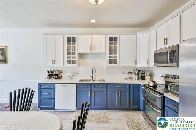 205 Maple Ct, Alburtis Boro, PA 18011 - kitchen with appliances with stainless steel finishes, blue cabinetry, white cabinets, light countertops, and recessed lighting
